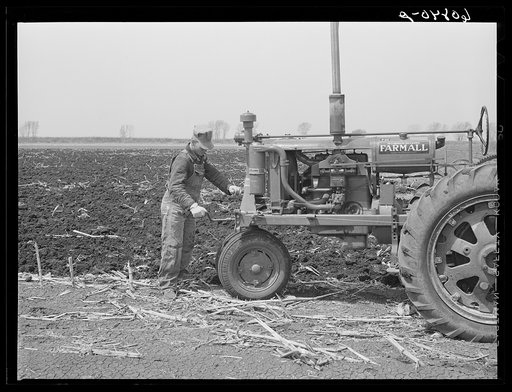 Cranking tractor while planting corn. Listing method. Monona County, Iowa