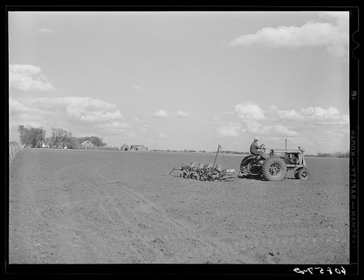 Planting corn with four-row tractor planter. Jasper County, Iowa