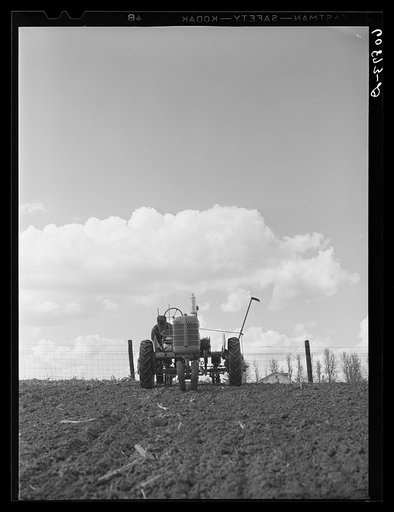 Adjusting wire on two-row tractor planter. Jasper County, Iowa