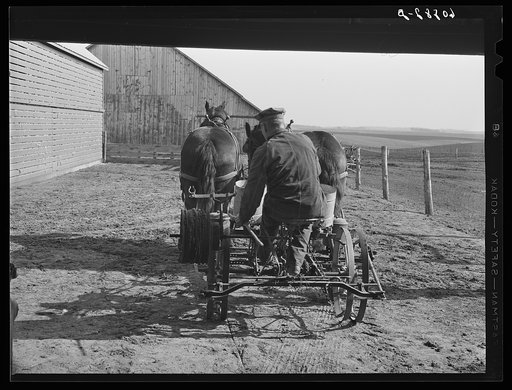 Untitled photo, possibly related to: Checking the planter before beginning corn planting operations. Jasper County, Iowa