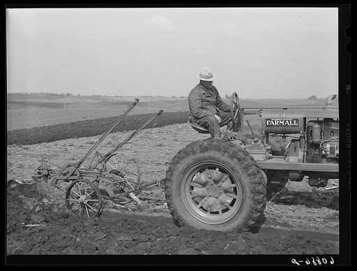 Untitled photo, possibly related to: County agent helping farmer adjust plow. Jasper County, Iowa