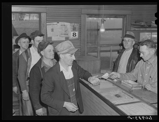 Granger homesteaders receiving paycheck at coal mine office. Iowa