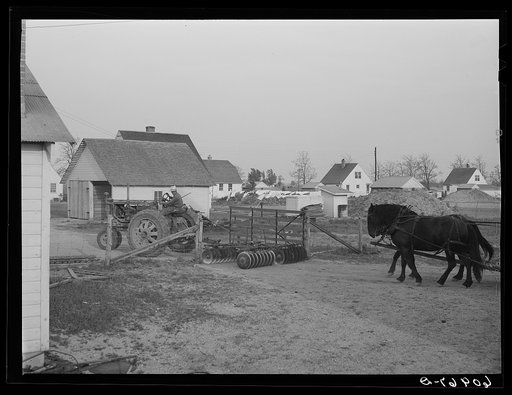 Tractor and horses coming in from field at end of day. Deshee Unit, Wabash Farms, Indiana