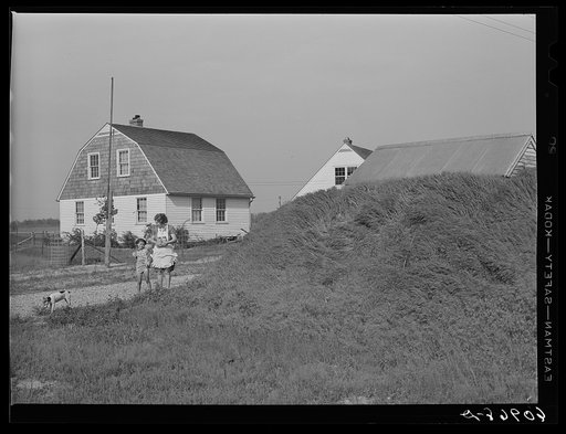 Storage house with grass embankment. Deshee Unit, Wabash Farms, Indiana