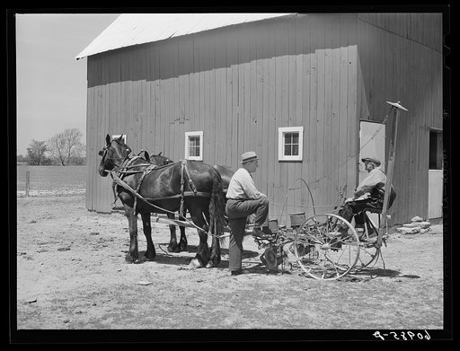 FSA (Farm Security Administration) tenant purchase borrower on corn planter, talking with county supervisor. Crawford County, Illinois