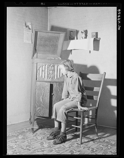 Daughter of FSA (Farm Security Administration) rehabilitation borrower listening to phonograph. Crawford County, Illinois
