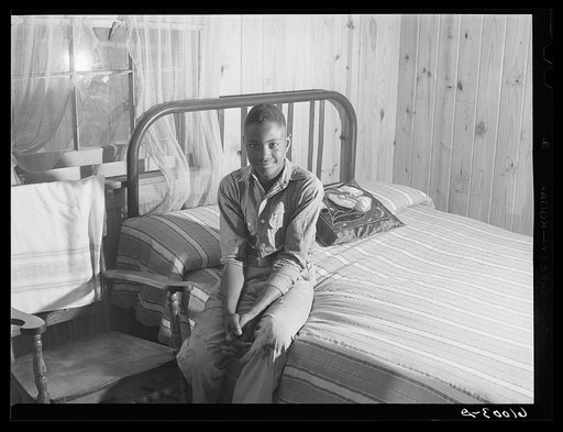 Boy at Southeast Missouri project in his bedroom