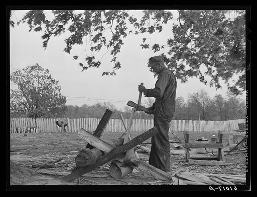 FSA (Farm Security Administration) rehabilitation borrower building a picket fence. Grant County, Illinois