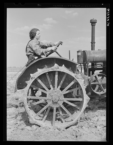 FSA (Farm Security Administration) rehabilitation borrower operating tractor. She and her mother run the farm without the assistance of any men. Grant County, Illinois
