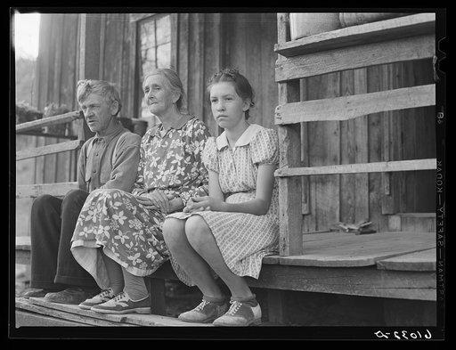 Old couple and their granddaughter farming in hilly Ozark country, Missouri