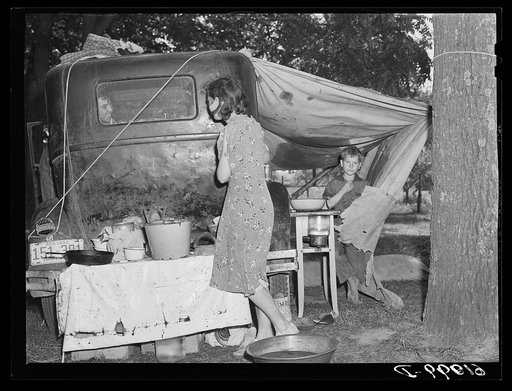Untitled photo, possibly related to: Fifteen farmers are camped along the roadside during cherry picking season. Berrien County, Michigan. There is one pump for these families
