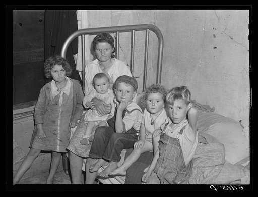 Mother, father, and five children sleep in this one room of an abandoned house on property of fruit grower. Berrien County, Michigan