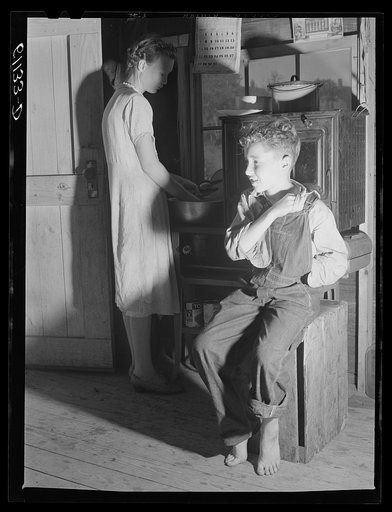 Interior of one-room cabin occupied by migrant fruit pickers and packing house workers. Berrien County, Michigan