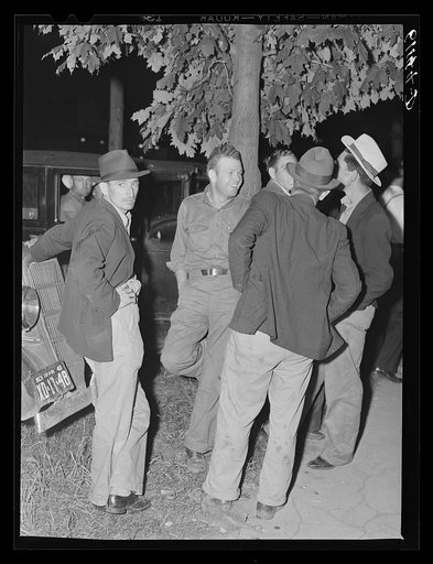 Migrant fruit workers in town on Saturday night. Millburg, Michigan