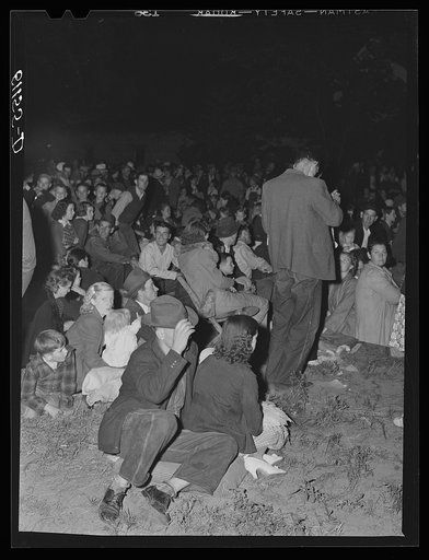 Untitled photo, possibly related to: Migrant fruit workers come to town on Saturday night for a free open air movie sponsored by the local merchants who remain open for business. Millburg, Michigan