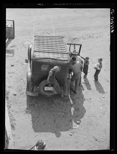 Family of migrant fruit worker about to move on in search of work. Berrien County, Michigan