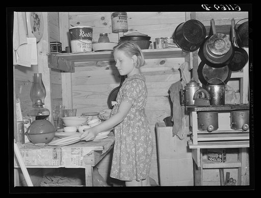 Daughter of migrant fruit worker in cabin (one room) which rents for one dollar and seventy-five cents a week. Berrien County, Michigan