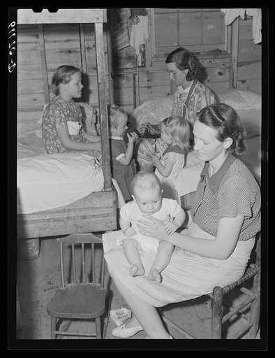 These women work in nearby packing house and live in company-owned one-room cabins. Rent one dollar and seventy-five cents a week. Berrien County, Michigan