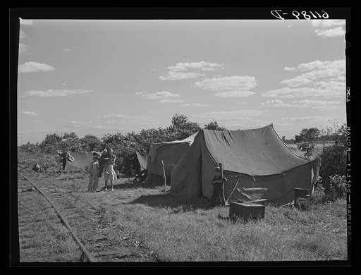 Migrant fruit worker camp along railroad tracks. Berrien County, Michigan