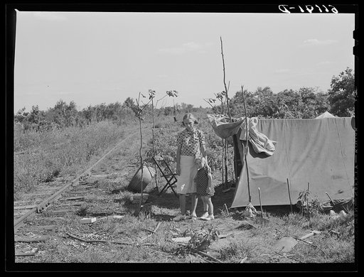 Family of migrant fruit worker camped along railroad tracks. Berrien County, Michigan