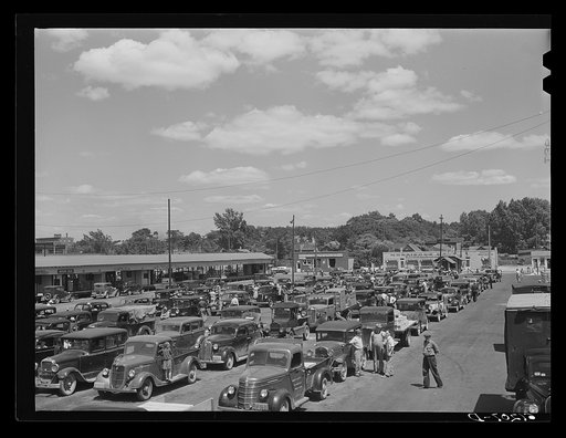 Fruit market. Benton Harbor, Michigan. Growers pay ten cents to drive truck through the market. If produce is not sold at the end of the line it must enter through the gate again