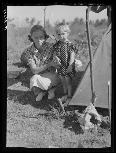 Wife and child of migratory fruit worker. Berrien County, Michigan