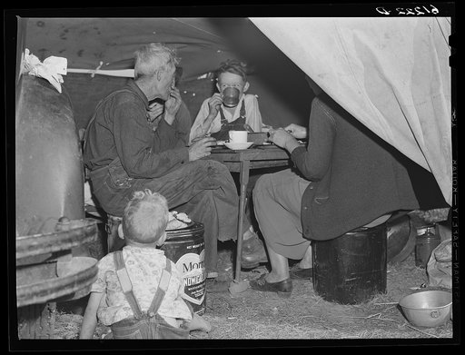 Migrant fruit workers at dinner. Berrien County, Michigan