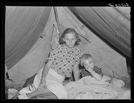 Wife and child of migrant fruit worker in their tent home. Berrien County, Michigan
