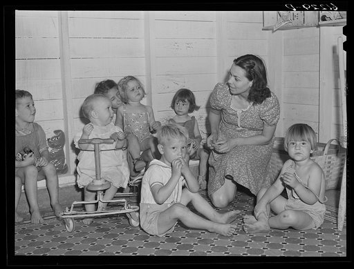 Untitled photo, possibly related to: Young children are taken to nursery school operated by Women's Council for Home Missions while parents are picking fruit. Berrien County, Michigan