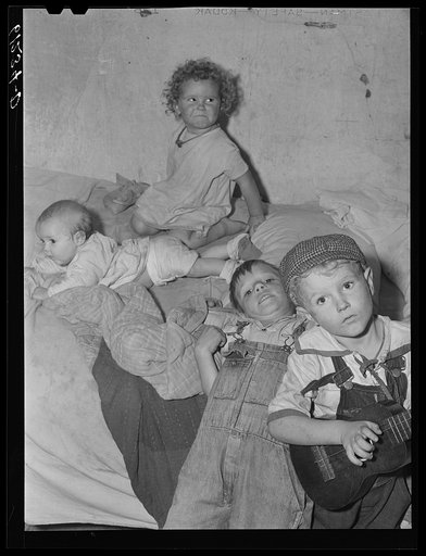 Untitled photo, possibly related to: Mother, father, and five children sleep in this one room of an abandoned house on property of fruit grower. Berrien County, Michigan