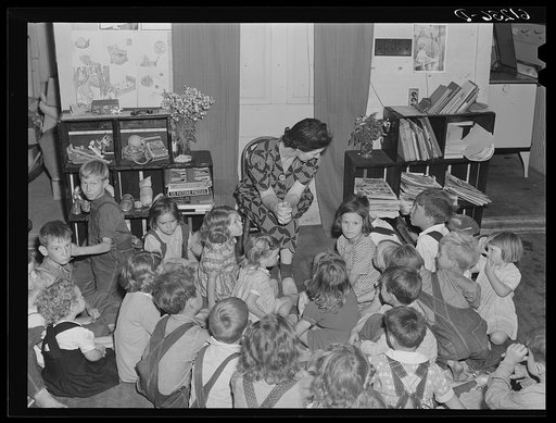 Untitled photo, possibly related to: Teacher telling story to migrant children in nursery school run by Women's Council for Home Missions. Berrien County, Michigan