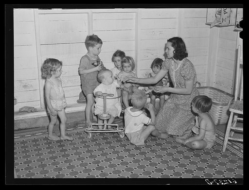 Young children are taken to nursery school operated by Women's Council for Home Missions while parents are picking fruit. Berrien County, Michigan