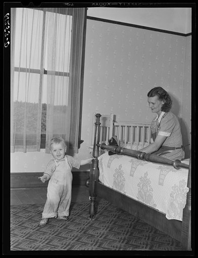 Untitled photo, possibly related to: FSA (Farm Security Administration) rehabilitation borrower and family. The wife made the drapes, the chair covers, and papered the wall herself. Door County, Wisconsin
