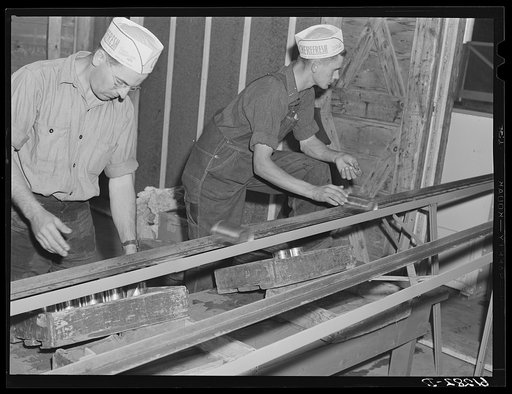 Loading boxes with cans of cherries. Canning plant, Door County, Wisconsin