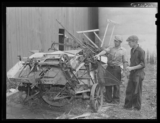 FSA (Farm Security Administration) borrowers looking over binder which they have purchased cooperatively. Door County, Wisconsin