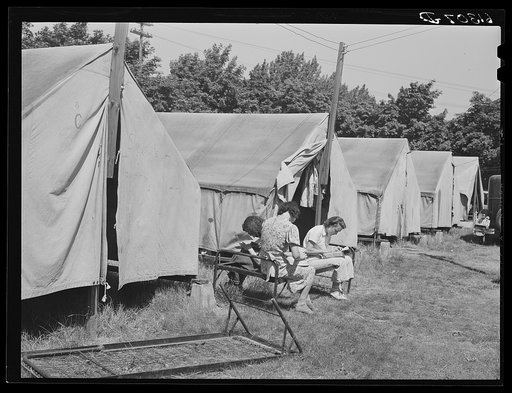 Cherry pickers writing letters home. They come from nearby states for a three-week season. Door County, Wisconsin