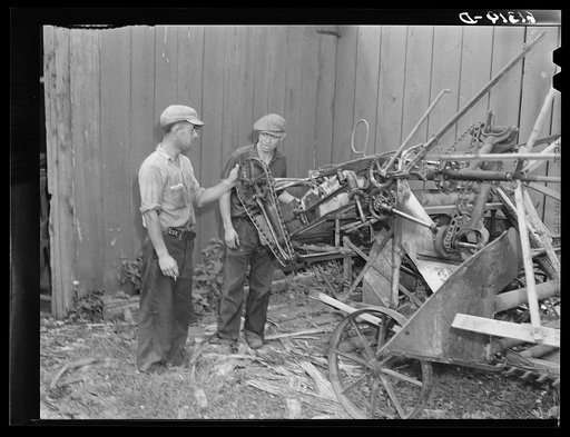 Untitled photo, possibly related to: FSA (Farm Security Administration) borrowers looking over binder which they have purchased cooperatively. Door County, Wisconsin