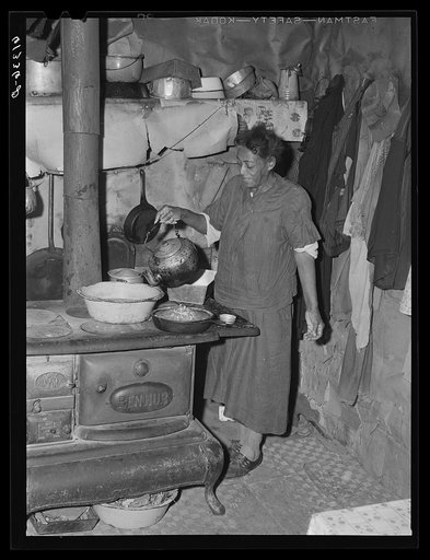 Mrs. Dyson, wife of FSA (Farm Security Administration) borrower, in her kitchen. Saint Mary's County, Maryland