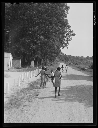 Children going home from school at noon. Saint Mary's County, near Scotland, Maryland