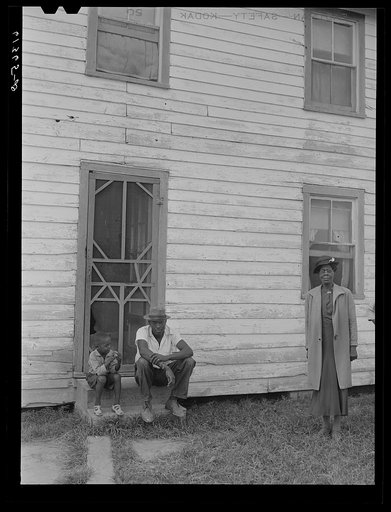 Untitled photo, possibly related to: John Barnes with his sons in front of their house. He is a FSA (Farm Security Administration) rehabilitation borrower. Saint Mary's County, Maryland