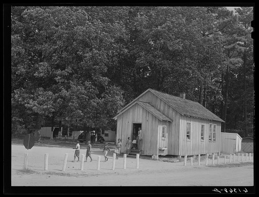 Untitled photo, possibly related to: Children coming out of school at noon. Saint Mary's County, Maryland