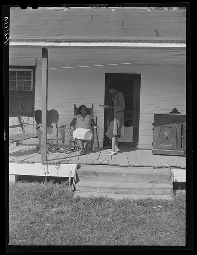 Margarite Chappelle, home supervisor of FSA (Farm Security Administration), writing out a check for Mrs. Harry Handy, rehabilitation borrower. Saint Mary's County, Maryland