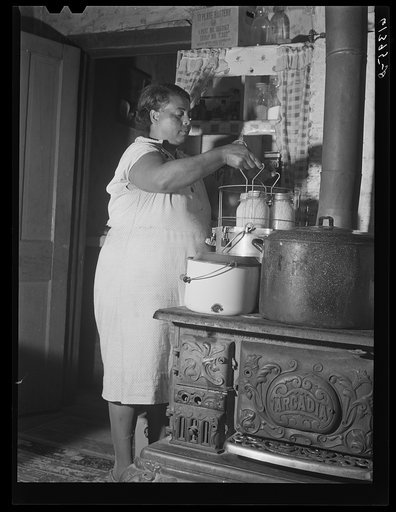 Mrs. Harry Handy canning corn with aid of pressure cooker. Saint Mary's County, Maryland