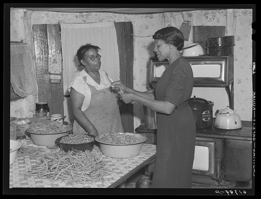 Miss Chappelle, home supervisor, helping Mrs. Smith can beans. Saint Mary's County, Maryland