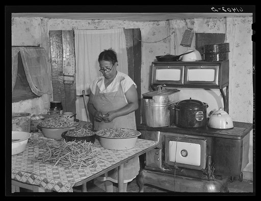 Mrs. Eugene Smith, FSA (Farm Security Administration) borrower, canning string beans. Saint Mary's County, Maryland