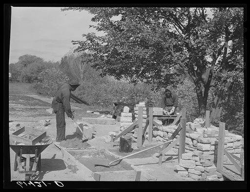 CCC (Civilian Conservation Corps) boys building charcoal burner at picnic grounds of recreation area. Ross County, Ohio