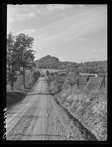 Gravel road running through the hilly farm land of Ross County, Ohio