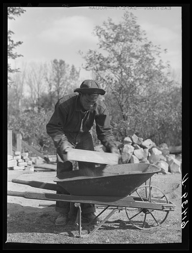 Untitled photo, possibly related to: CCC (Civilian Conservation Corps) boy chopping stone for use in building charcoal burners at picnic grounds. Ross County, Ohio, recreation area