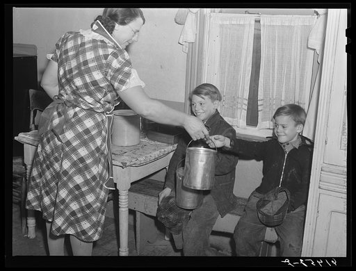 Untitled photo, possibly related to: Mrs. Sauer packing lunches for children before school. Cavalier County, North Dakota