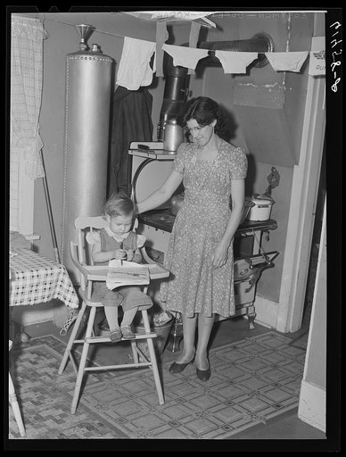 Mrs. Schroeder, wife of FSA (Farm Security Administration) borrower, with daughter. Cavalier County, North Dakota